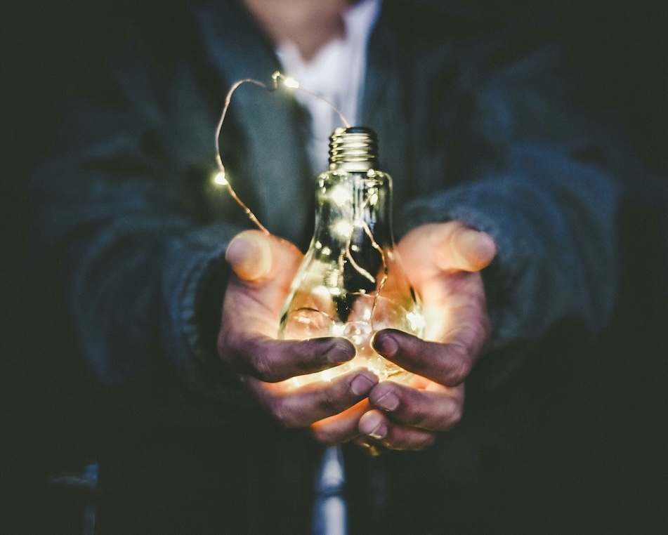 A man holding a lightbulb